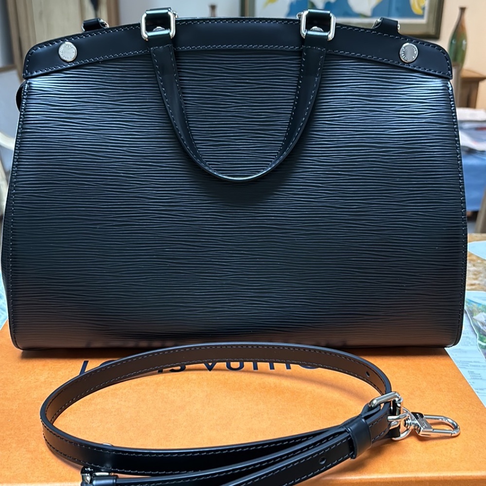 Authentic Louis Vuitton Medium Black Epi Bag is in perfect condition
